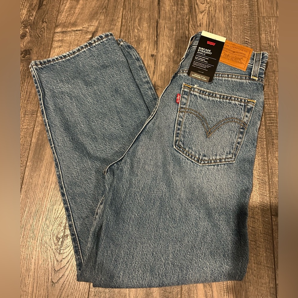 Levi’s blue ripped jeans, straight leg, with tags, size 25